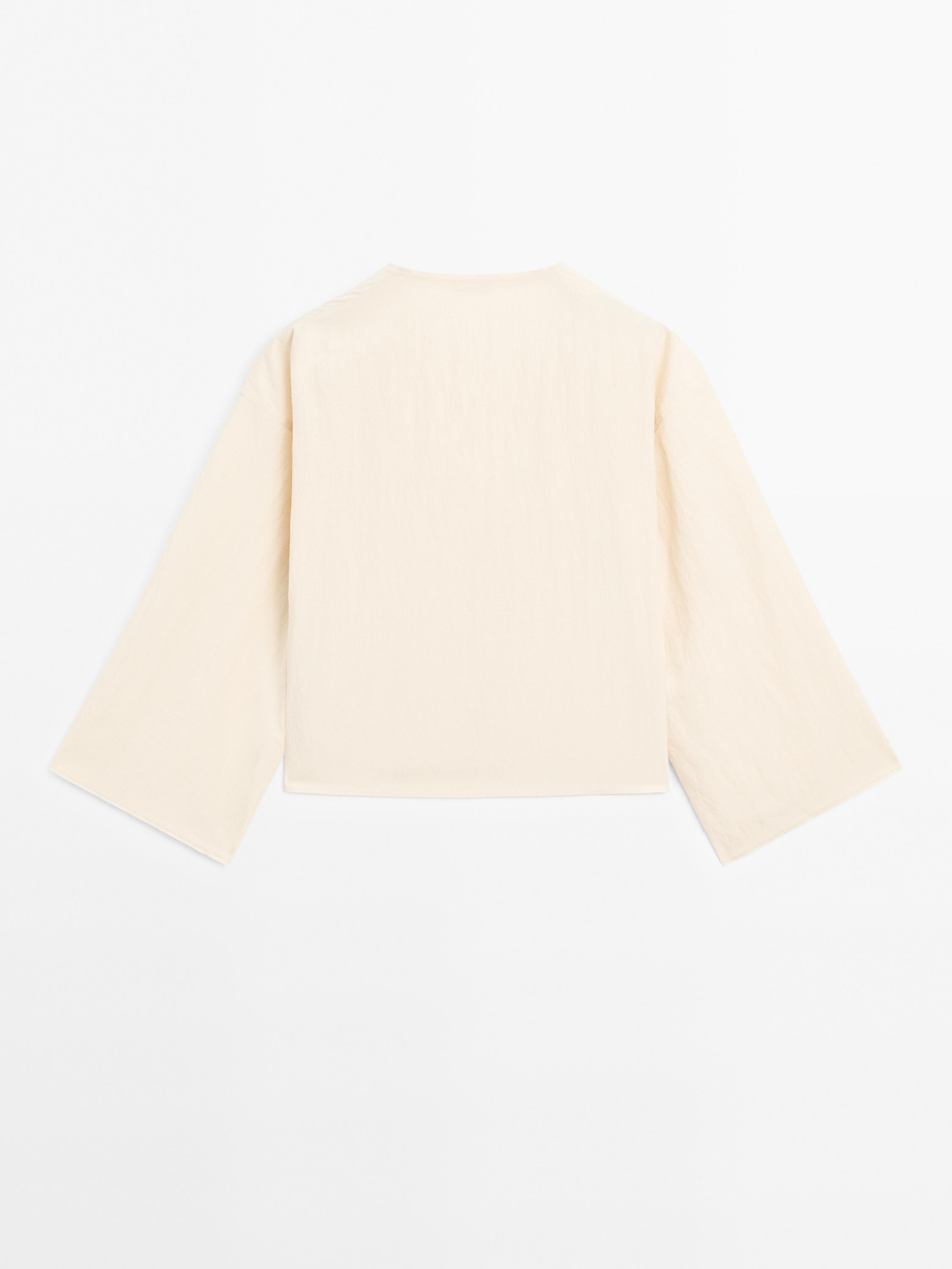 Long sleeve blouse with side button fastening